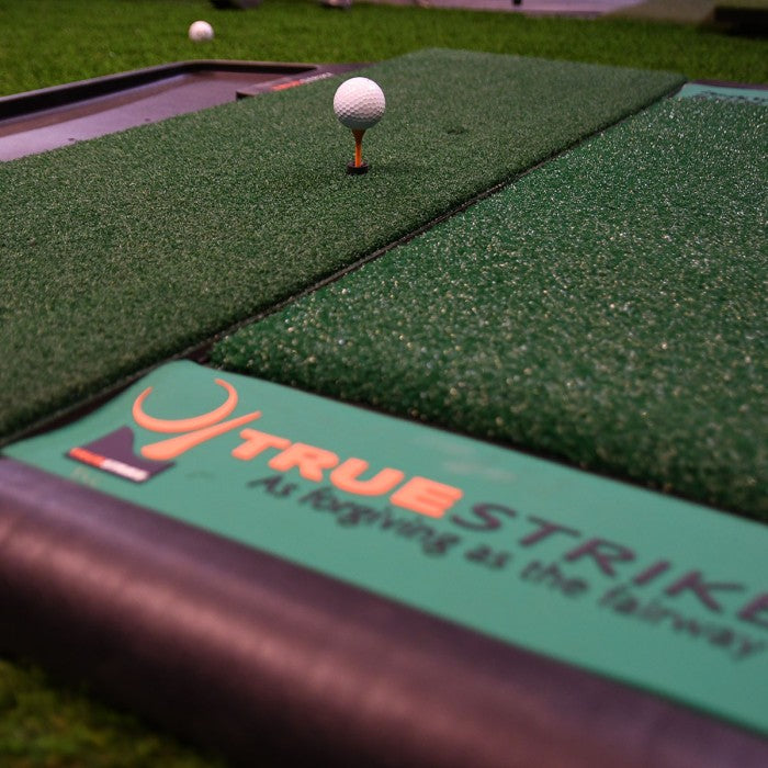 simulator golf mat closeup with ball and tee