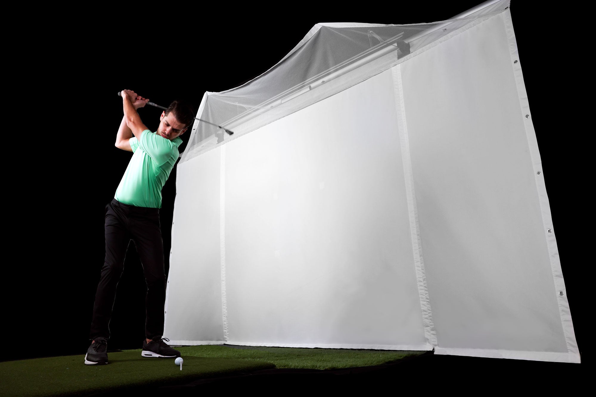 outdoor golf simulator enclosure action shot