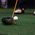 indoor golf simulator hitting mats with club